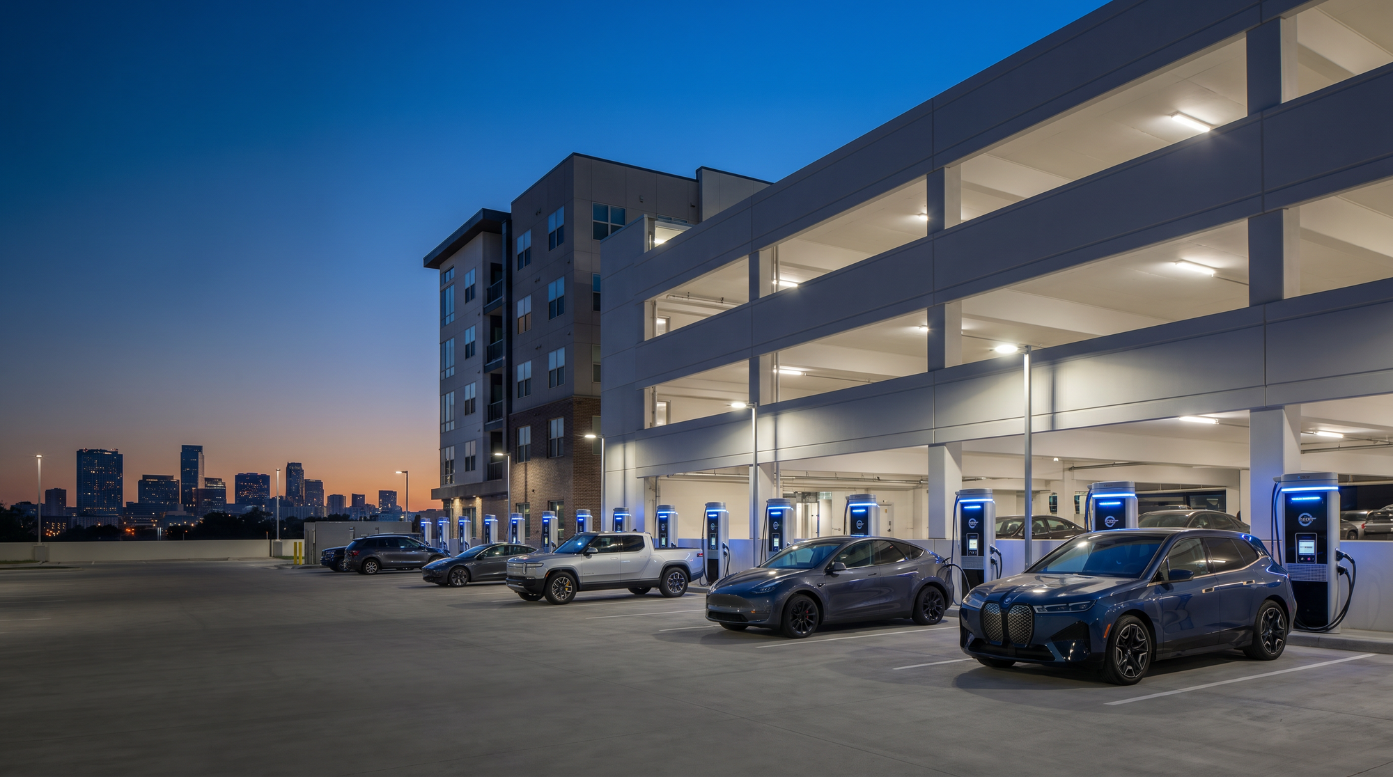 Parking garage with cars at night, city skyline in the background